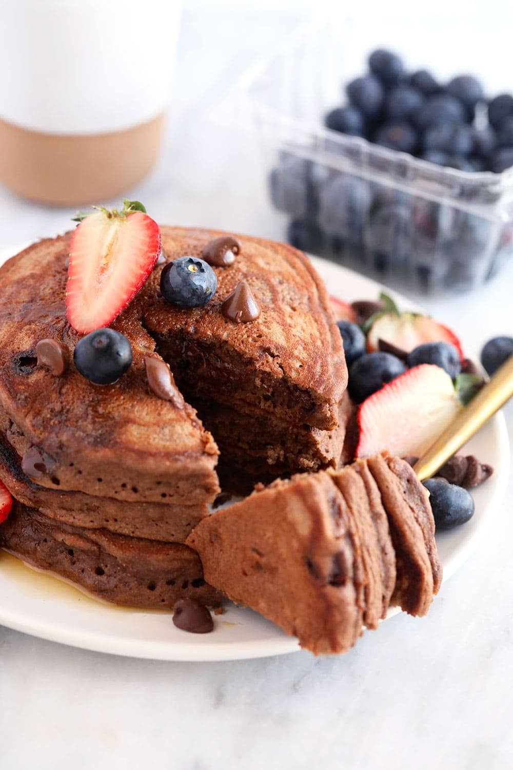 3 chocolate chocolate chip pancakes on a plate