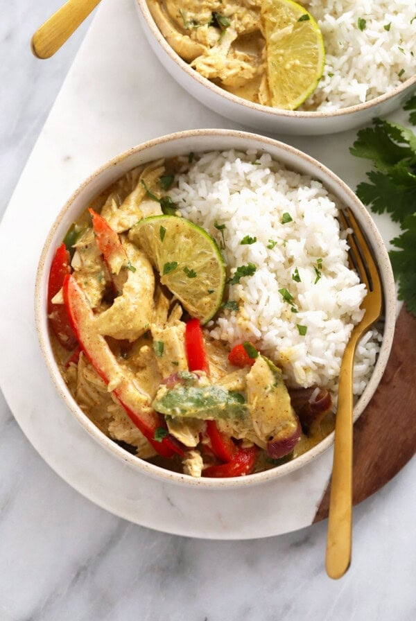 Coconut curry chicken in a bowl with rice.