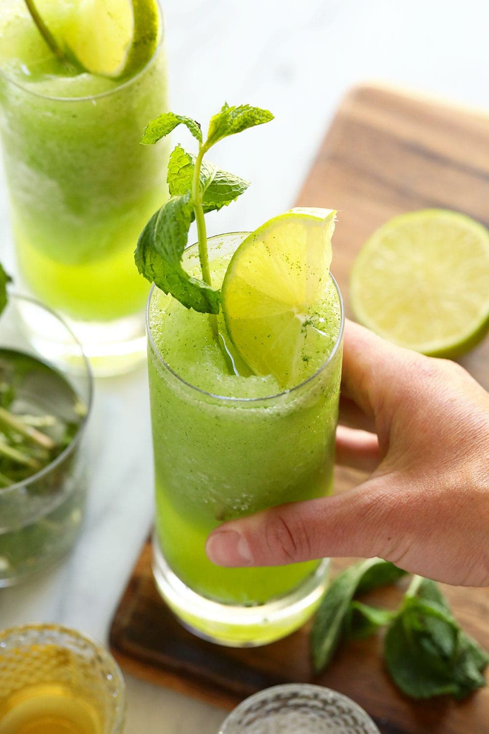 hand holding blended mojito