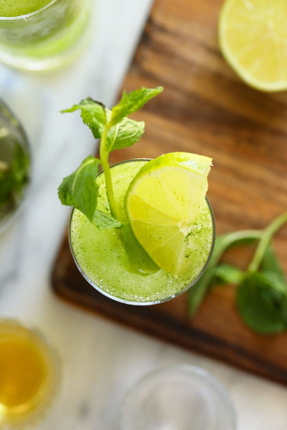 top down photo of frozen mojito with fresh mint and lime