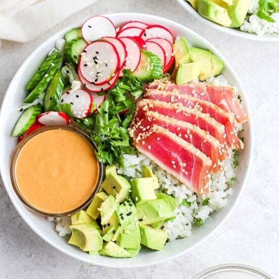 A fit foodie bowl with tuna, avocado, and radishes.