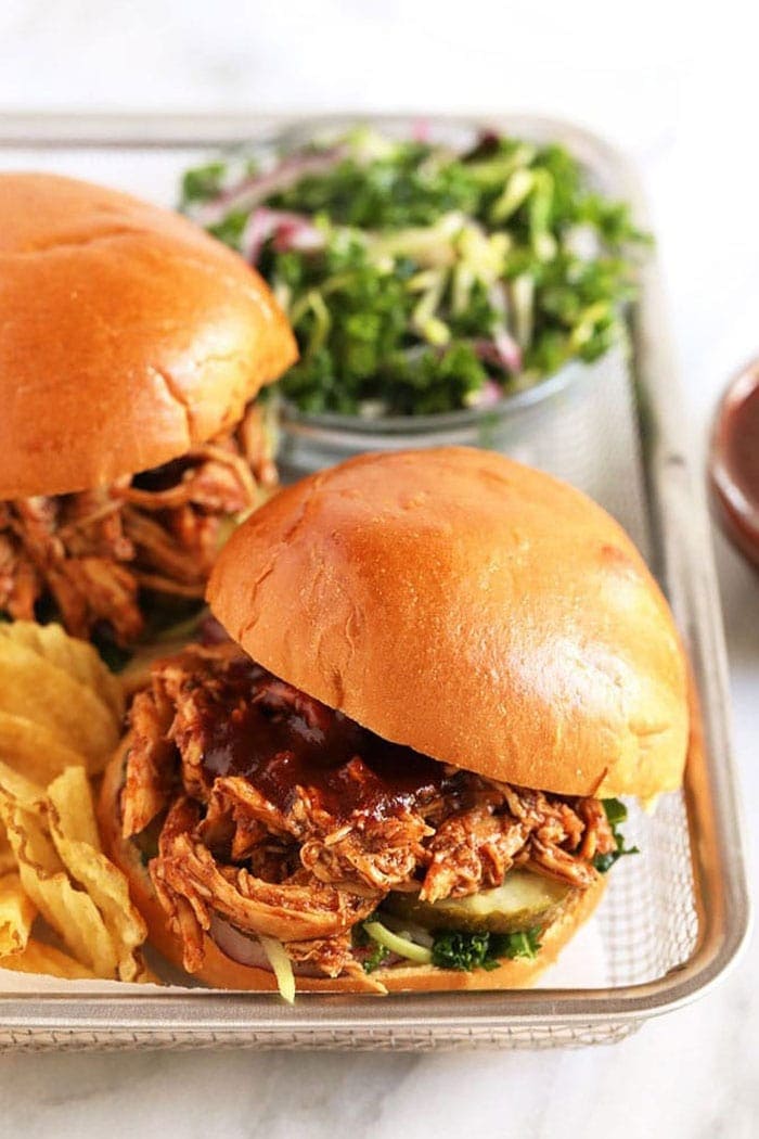 pulled chicken on bun with chips