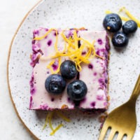 blueberry cheesecake bar on a plate.