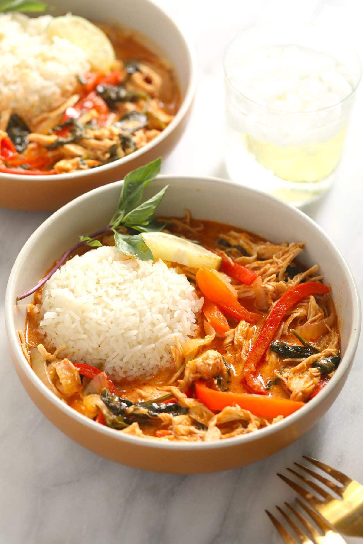 coconut curry in bowl with forks