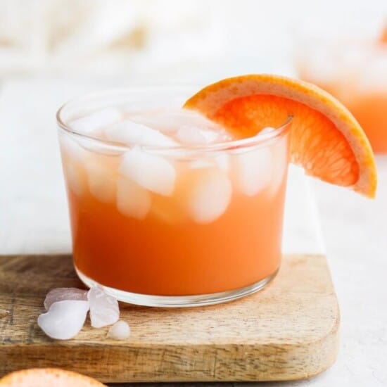 a glass of paloma grapefruit cocktail