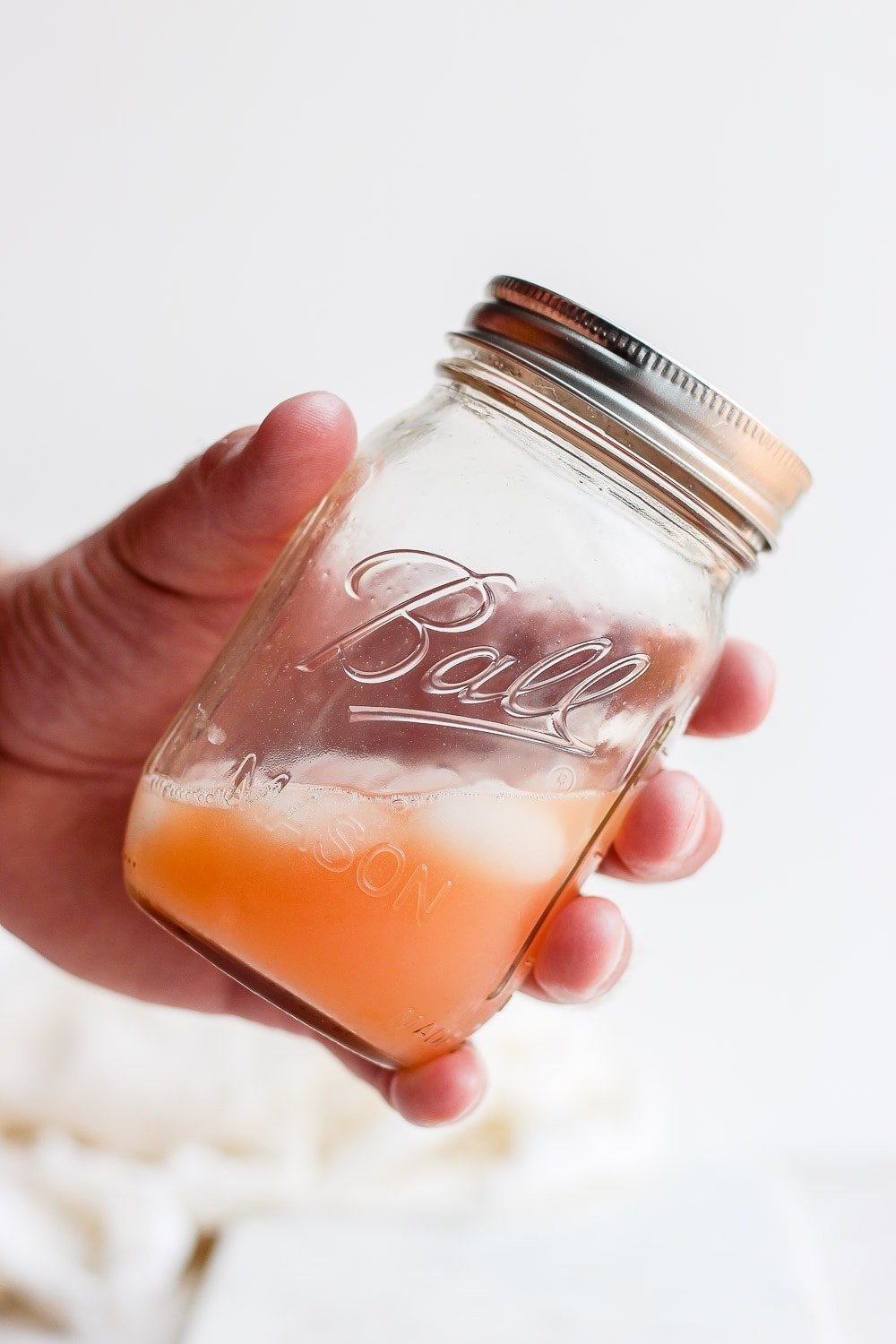 paloma cocktail in a mason jar with ice 