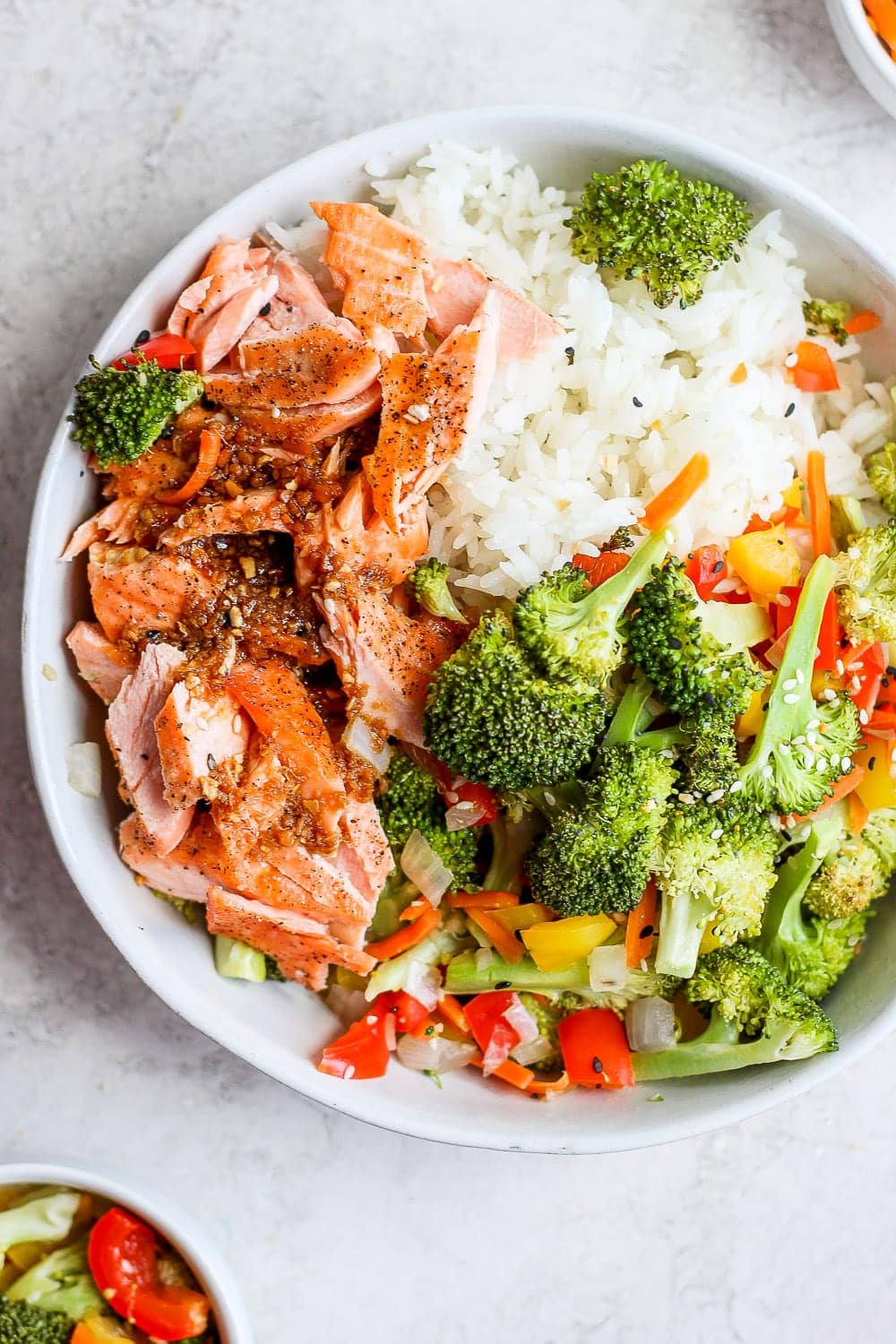 sheet pan salmon stir fry in a bowl with rice