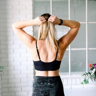 Fit foodie finds a woman wearing a black sports bra and camouflage shorts.