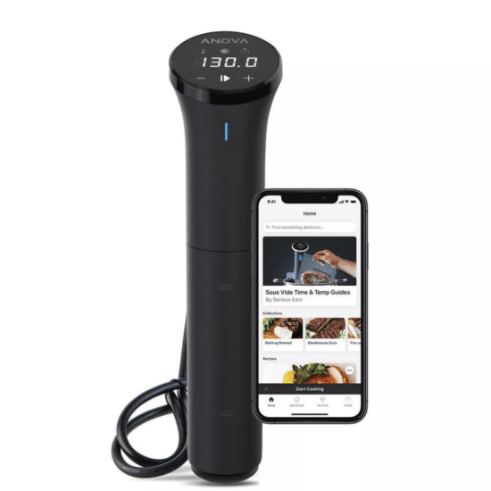 A smartphone is next to a sous vide food steamer.