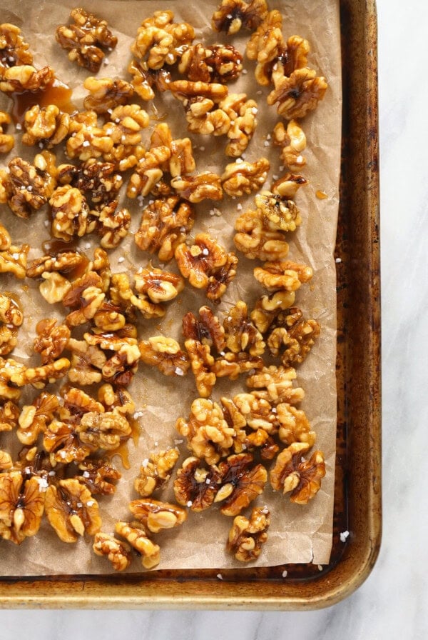 toasted walnuts on a baking sheet.