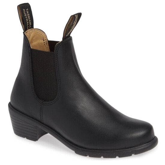 a black chelsea boot with a zipper on the side.
