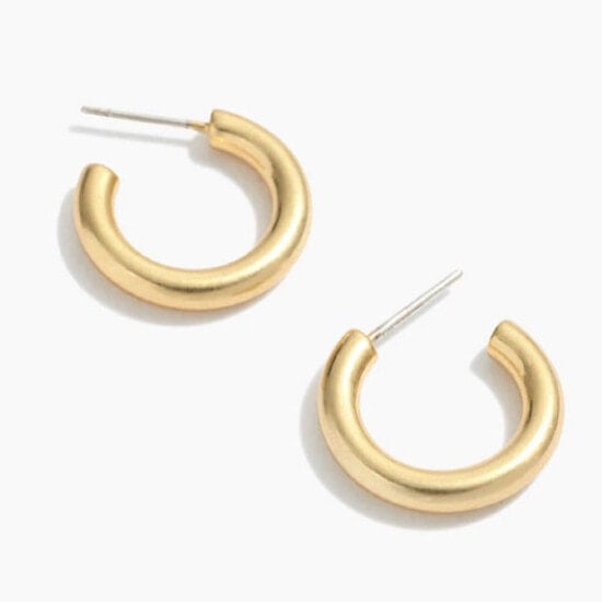 a pair of gold hoop earrings on a white background.