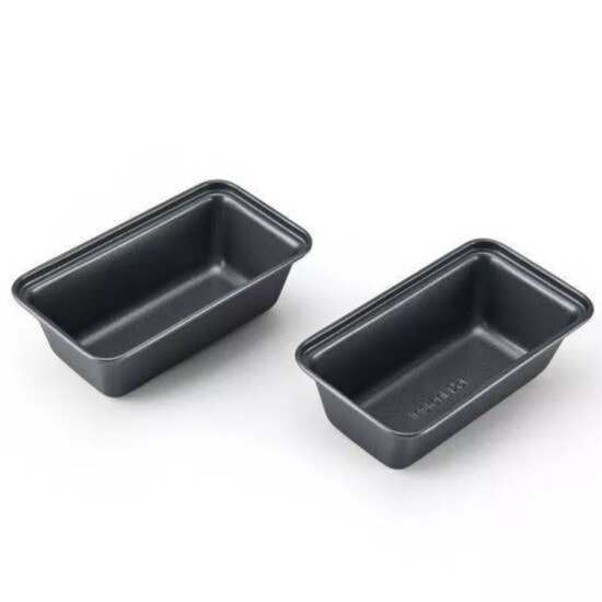 two black baking pans on a white background.