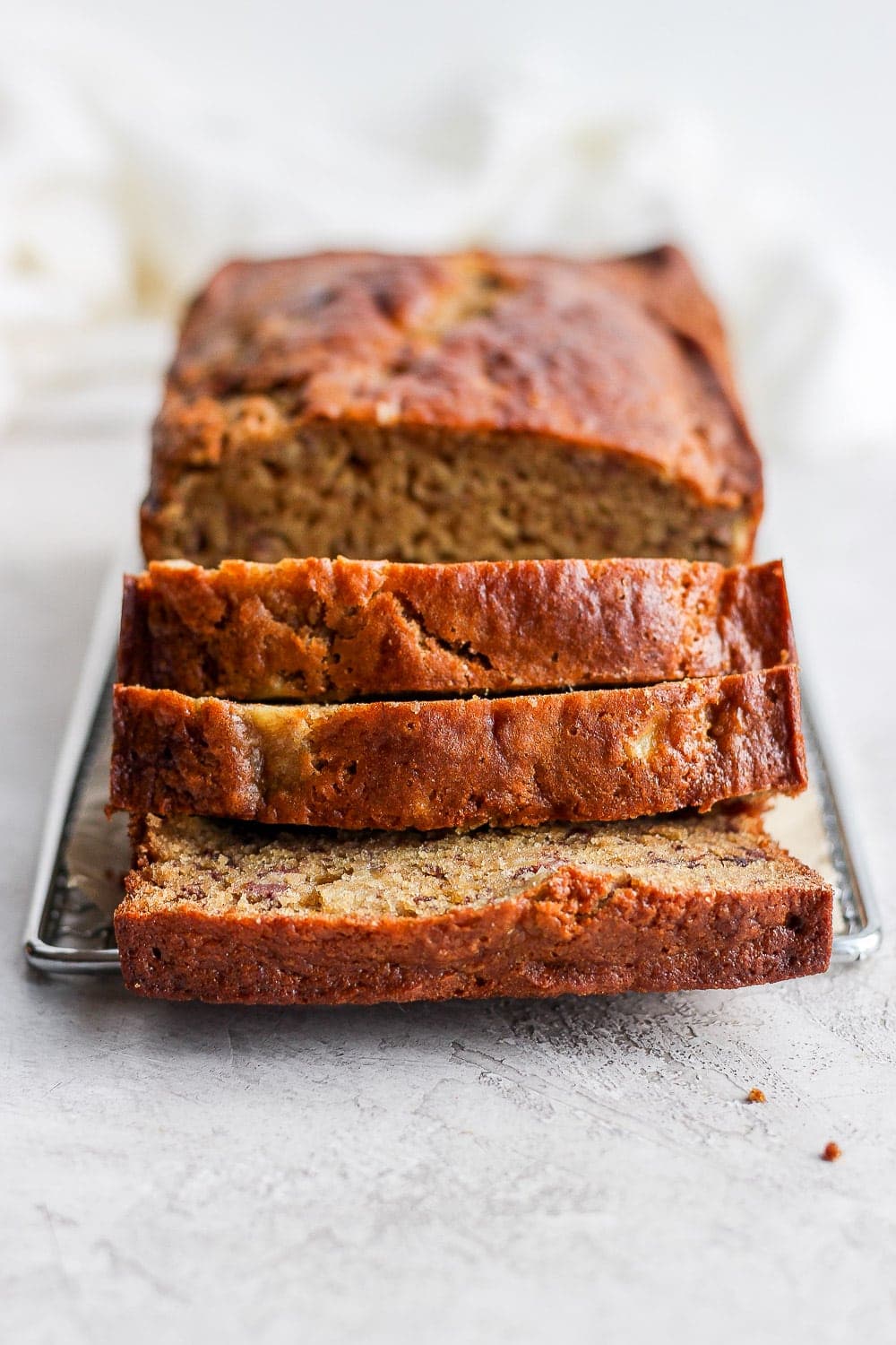 sliced banana bread on cooling rack