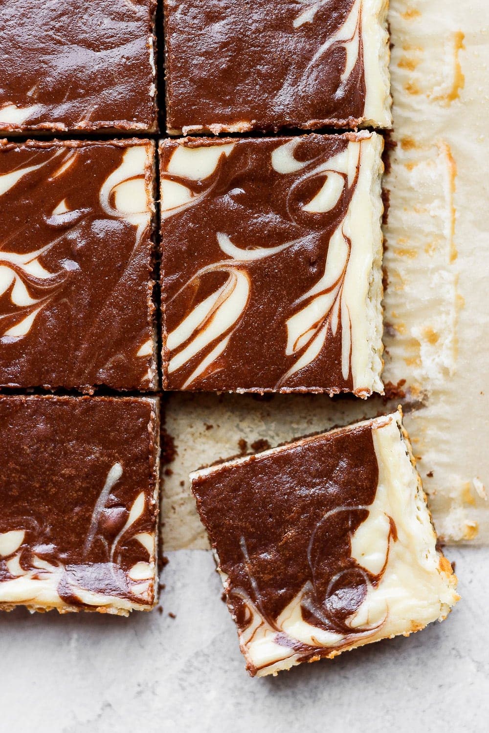 Cheesecake bars in a pan. 