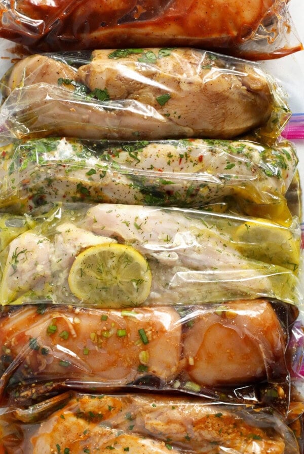 6 chicken marinades in plastic bags.