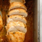 chicken marinating in a pan.