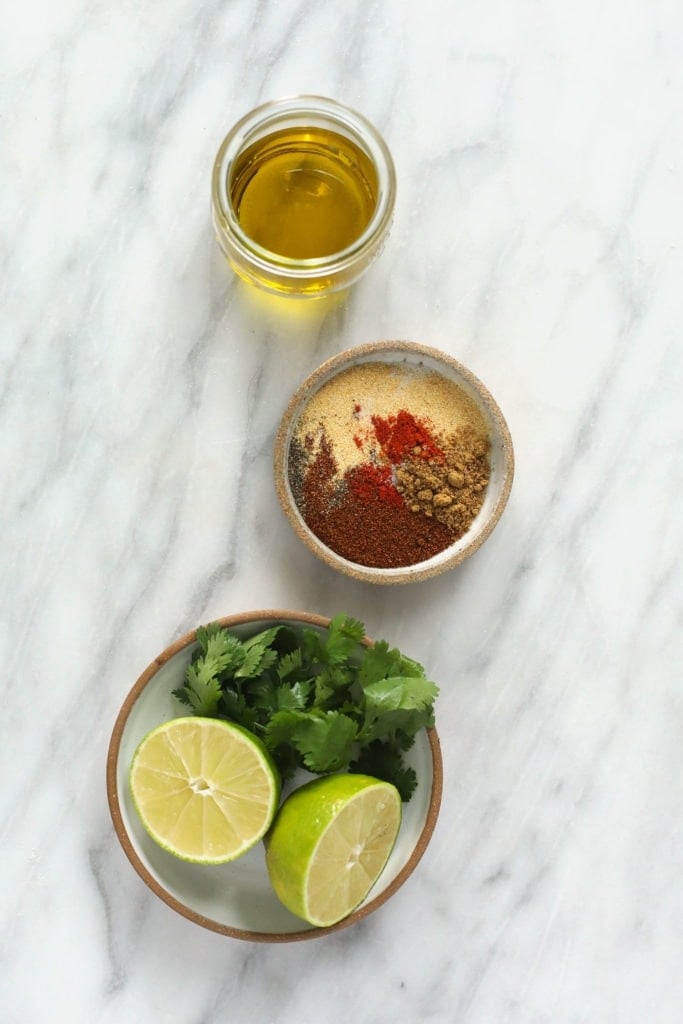 Chicken marinade ingredients in a few small containers. 