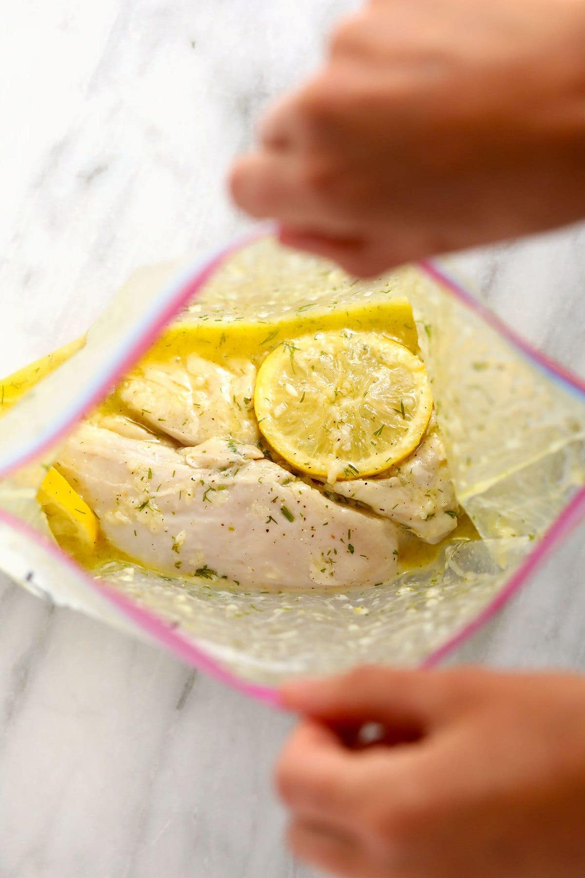 lemon chicken marinating in a gallon size bag