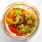 A jar with quick pickled spicy peppers.