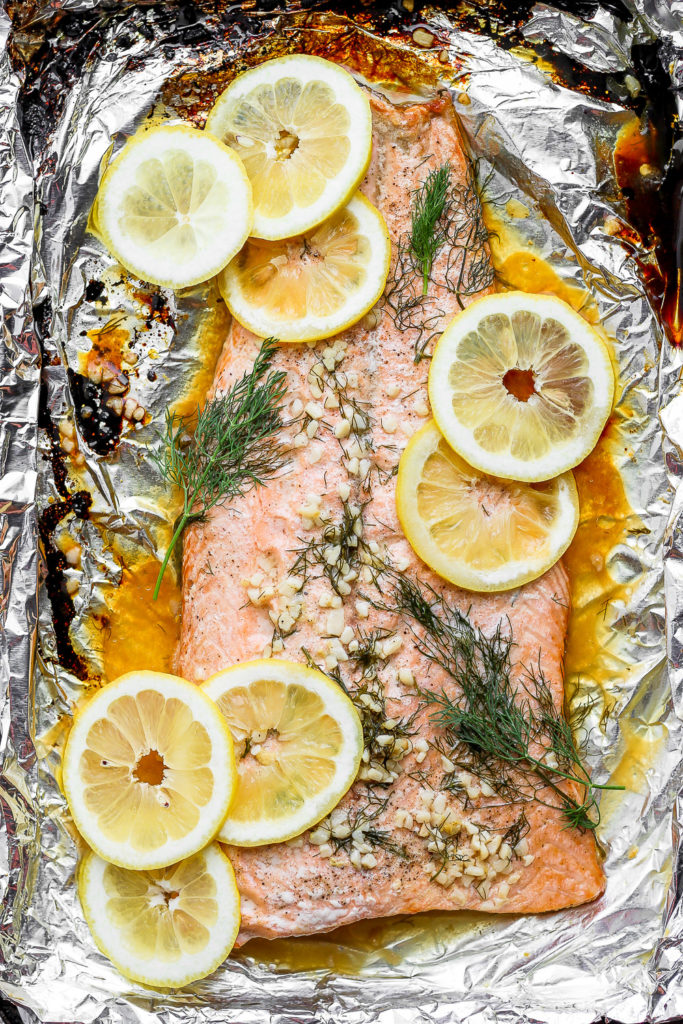 Baked salmon fillet on a baking sheet. 