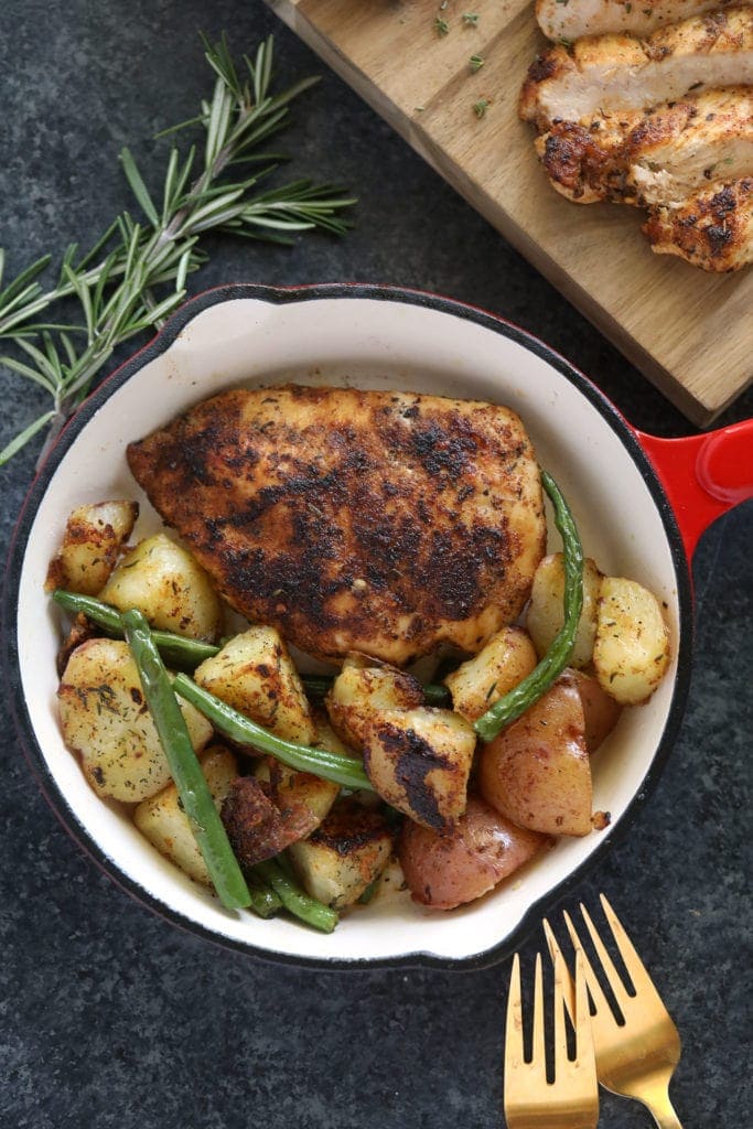 chicken breast in pan with potatoes