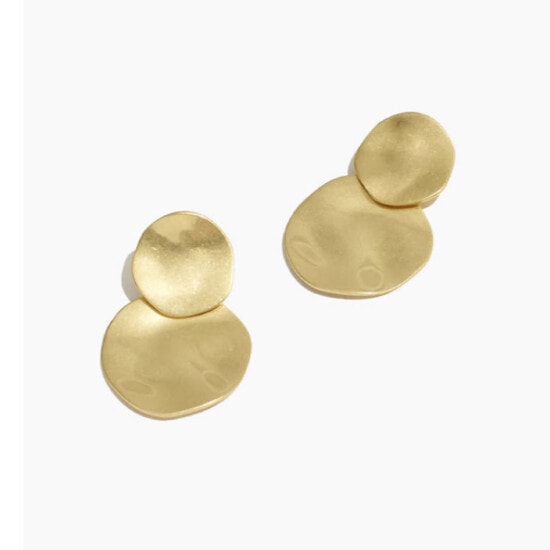 a pair of gold plated earrings.