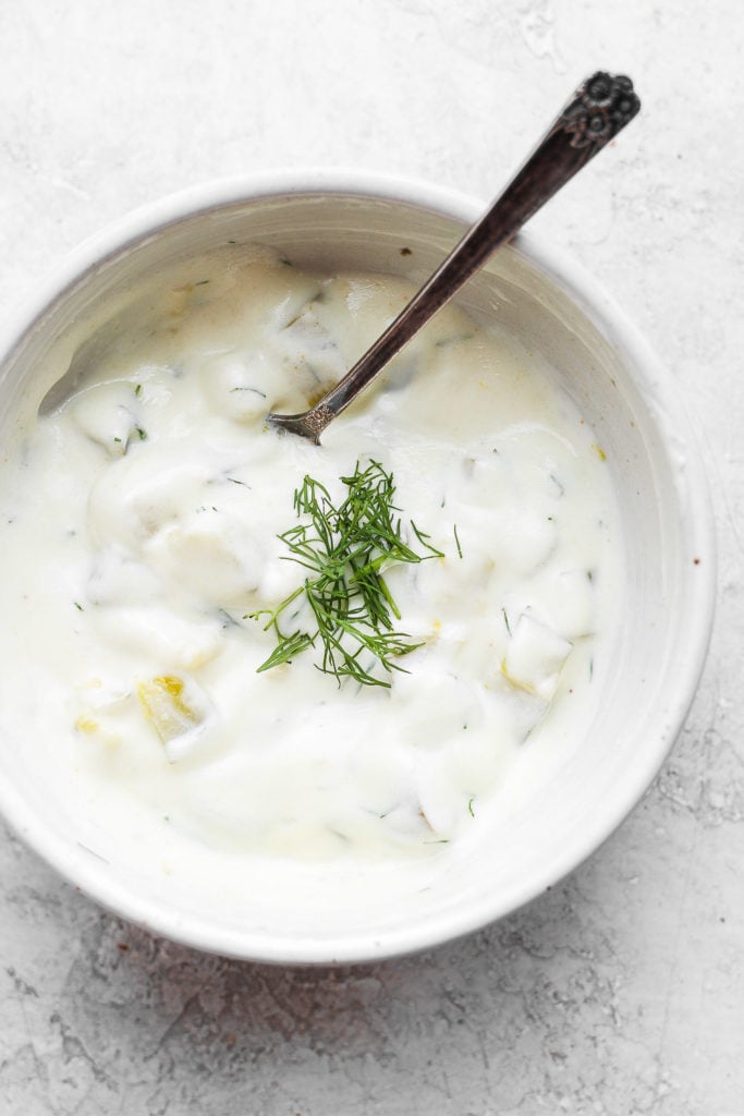 dill pickle dip in bowl with spoon