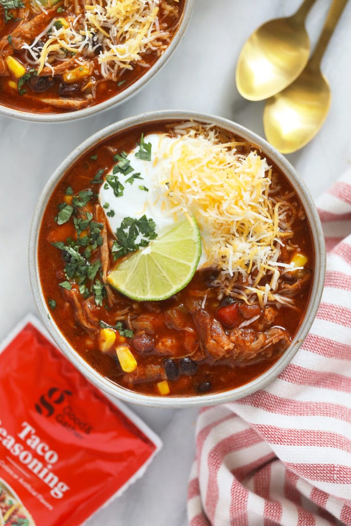 This Instant Pot Pork Chili is about to be your new go-to chili recipe. It's made with 5 basic ingredients including a pork shoulder butt roast, beans, taco seasoning, and a jar of salsa!