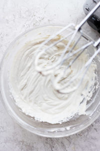 Cream cheese frosting in a bowl.