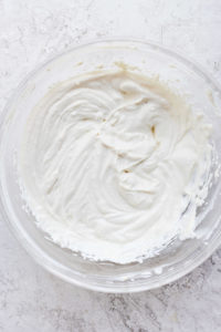 Cream cheese frosting in a bowl.