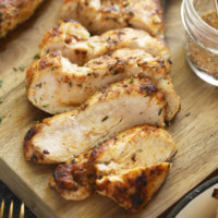 sliced chicken breast on cutting board.
