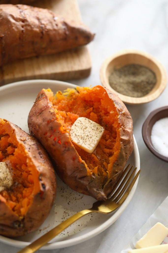 baked sweet potato with butter on plate