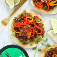 Guacamole tostada with peppers.