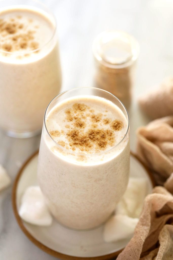 Coconut chai protein shakes in two glasses. 