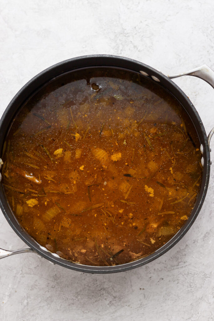 Chicken broth in a pot. 