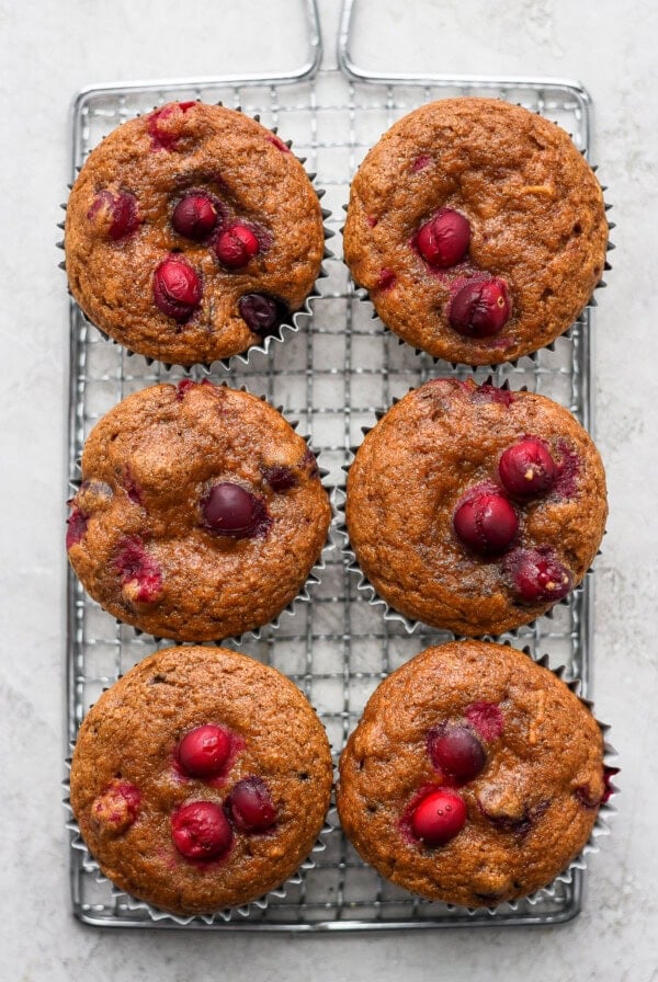 cranberry orange muffins on a cooling rack