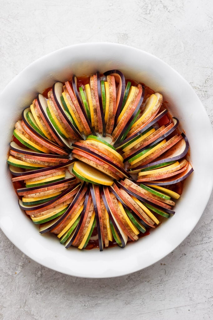 Vegetables for ratatouille in a baking dish. 