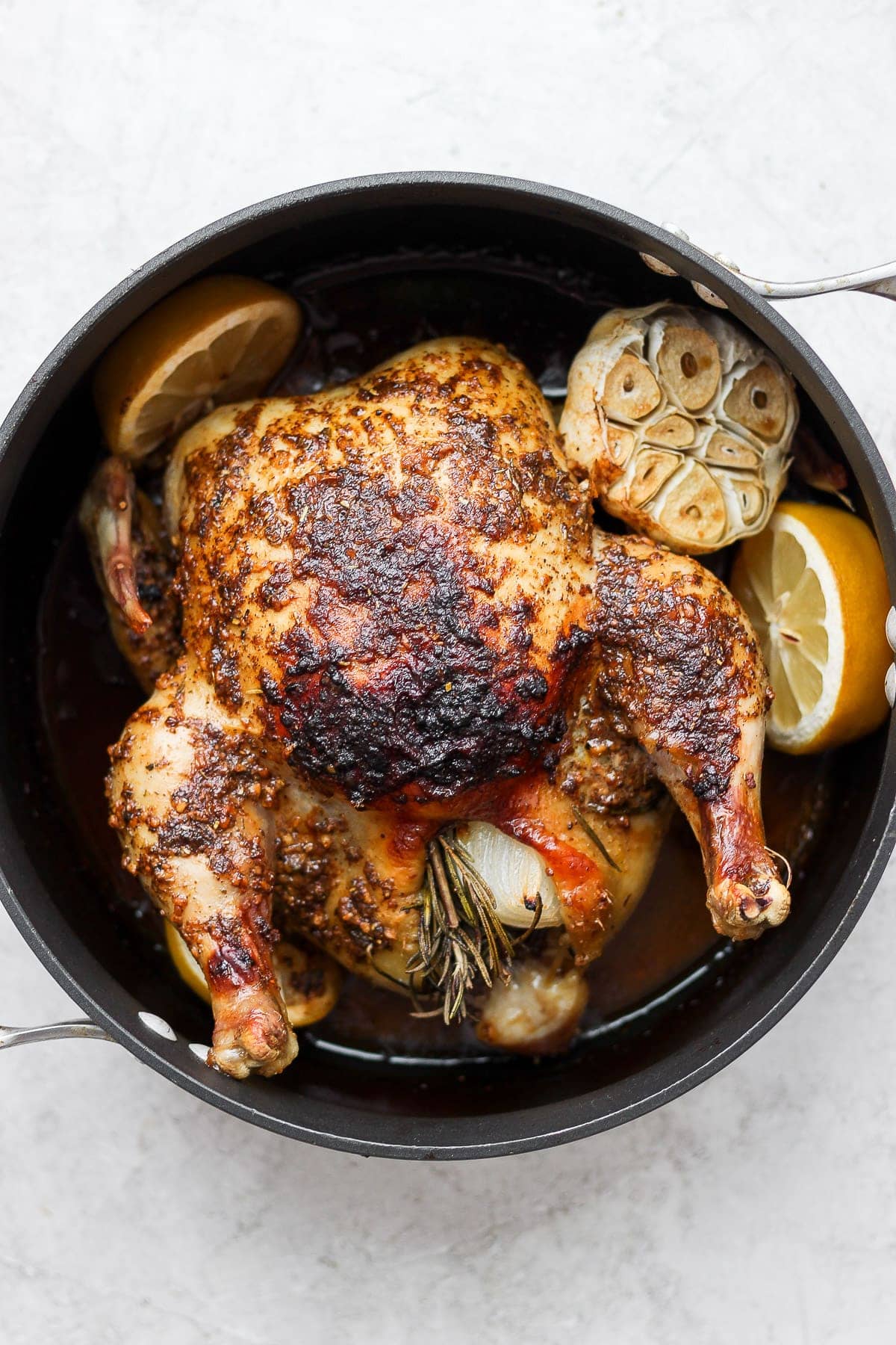 whole roasted chicken in pan