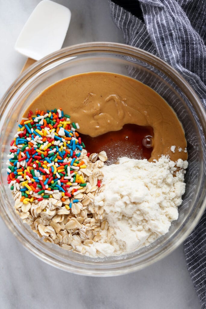 cake batter protein ball ingredients in a bowl ready to be mixed