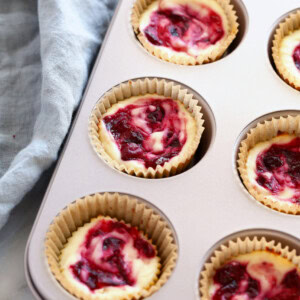 cranberry cheesecakes in a muffin tin.