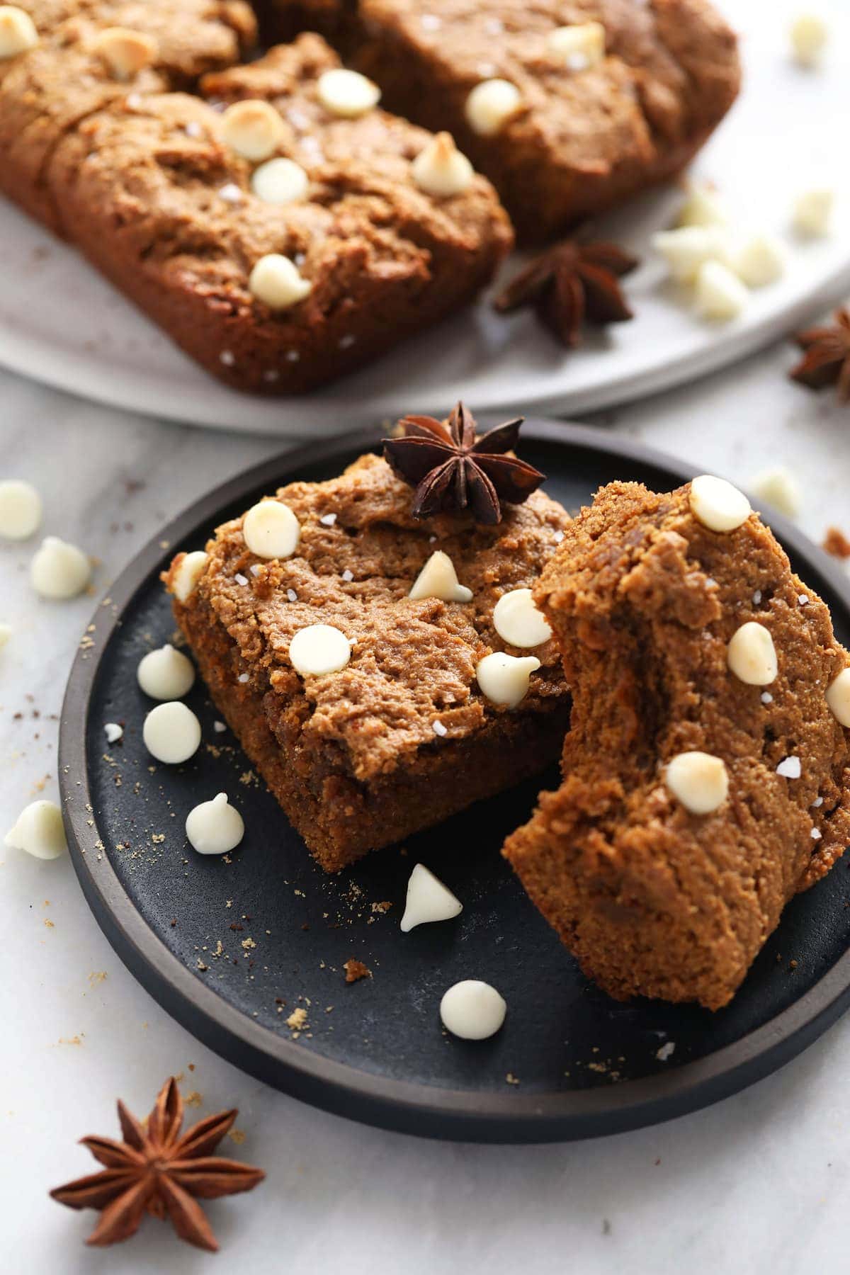 gingerbread cookie bars topped with white chocolate chips