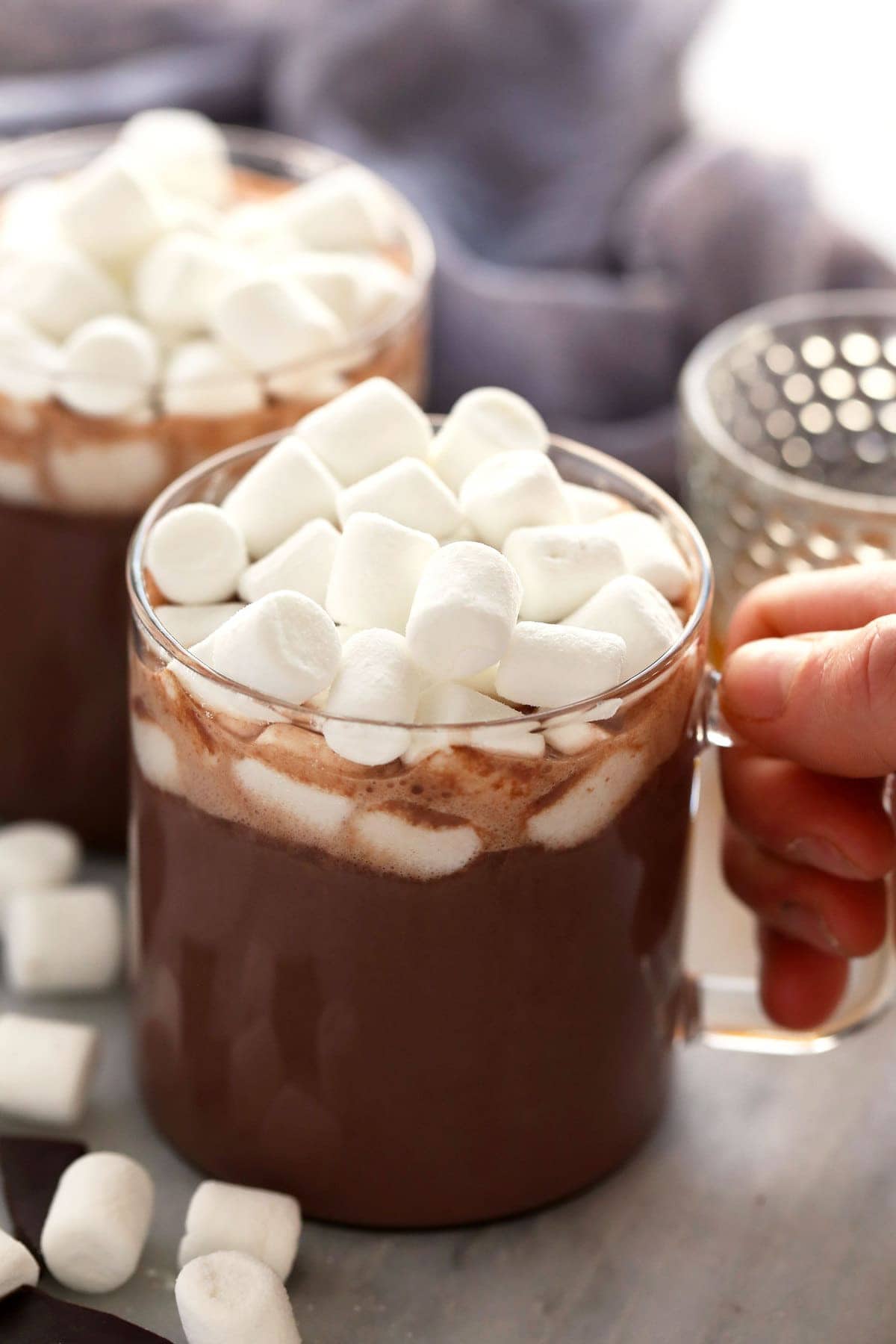 spiked hot chocolate in a mug topped with mini marshmallows