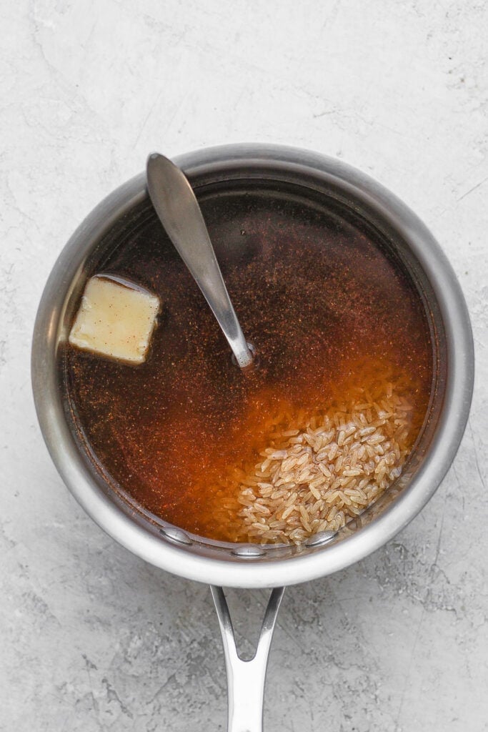 brown rice and beef broth, ready to be cooked in a stock pot