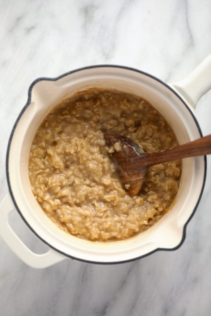 Creamy savory oatmeal in a small pot. 