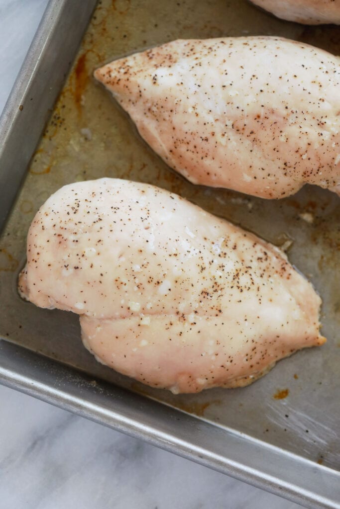 chicken breast on a baking sheet