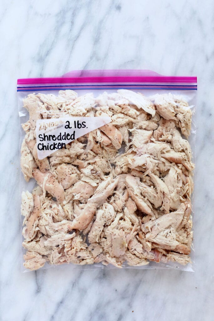 shredded chicken breast in a ziploc bag ready to be frozen
