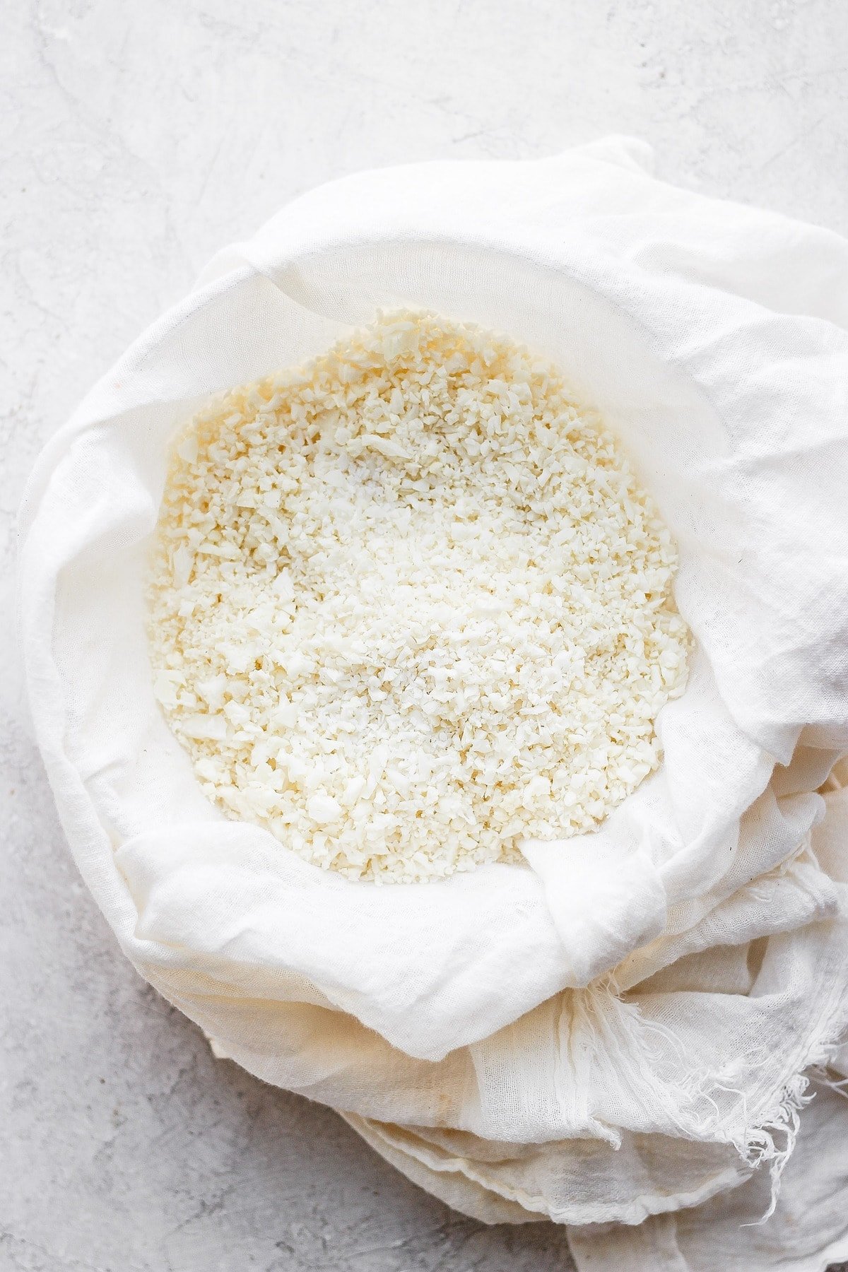 Cauliflower rice in a tea towel. 