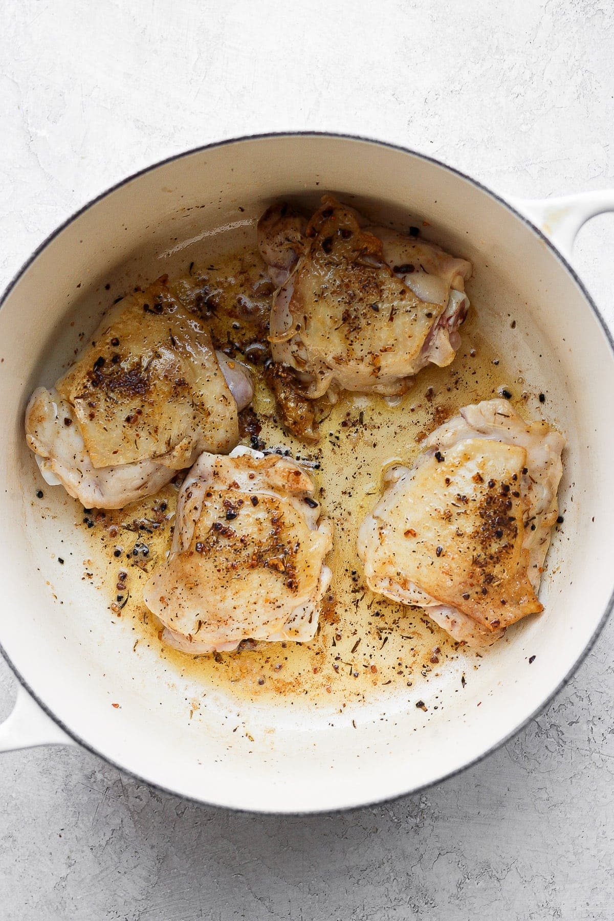 sautéed chicken thighs in Dutch oven.