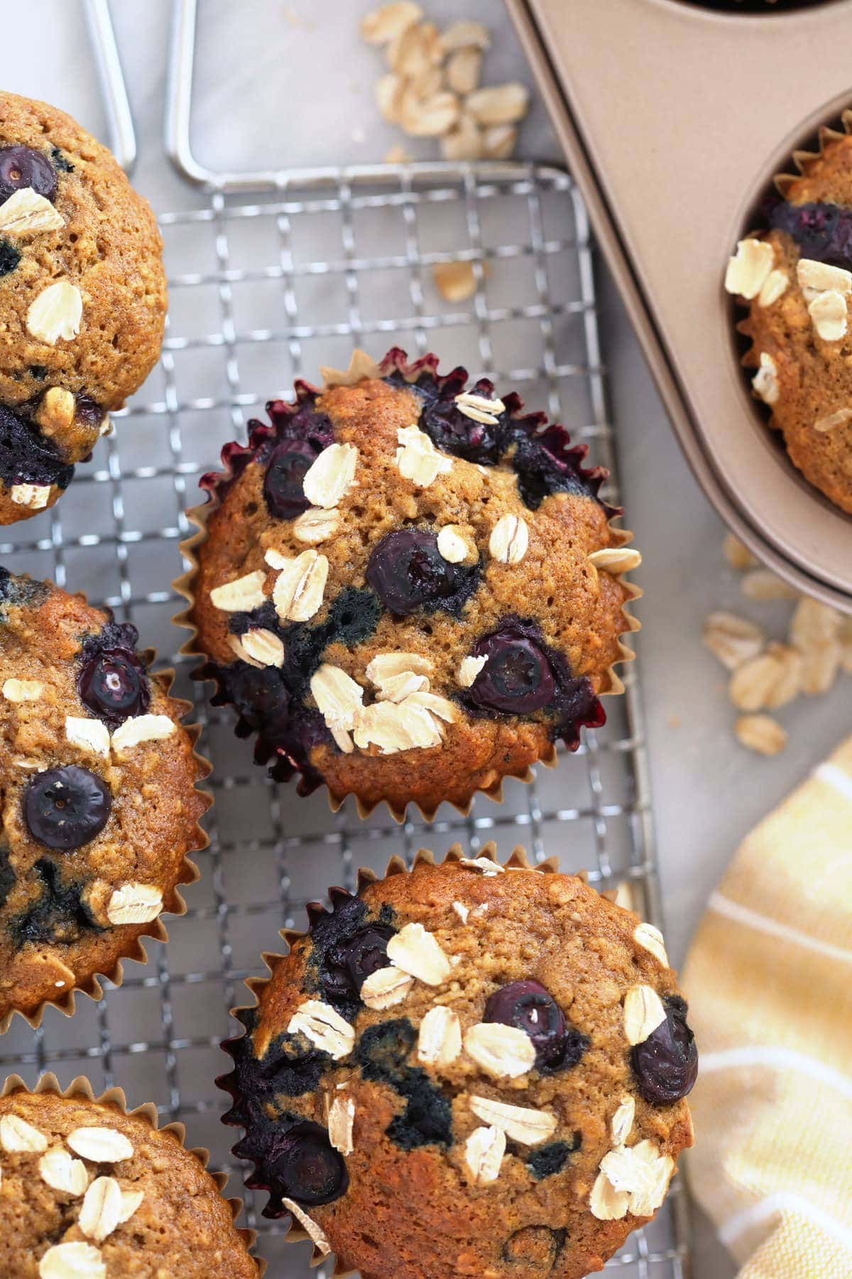 blueberry oatmeal muffins topped with rolled oats